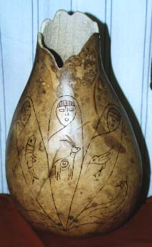 [Picture of a tall gourd with a graphic depicting the three parts of the world: air, land, and water]