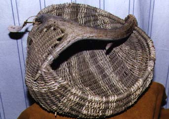[Picture of a basket with a deer antler for a handle]